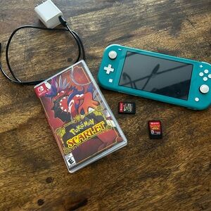 Nintendo Switch Lite Blue Console with Pokémon Scarlet and 2 games.